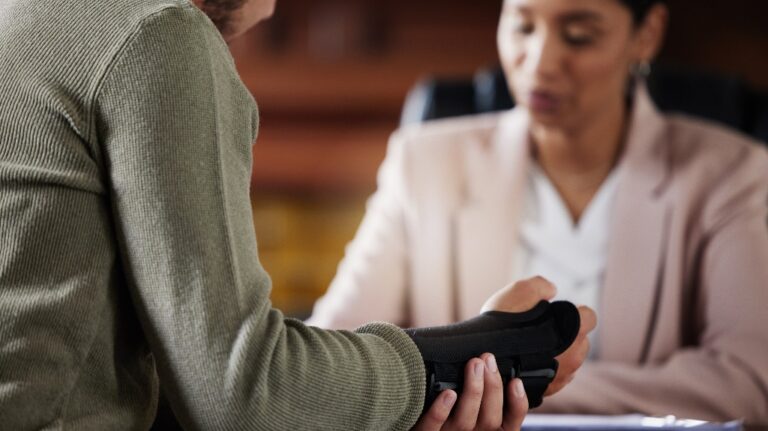 man is consulting with lawyer after work injury