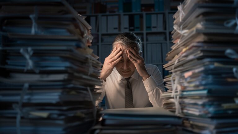 Man feeling worn down by work