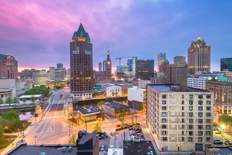 Milwaukee skyline at dusk, featuring the city's iconic buildings.
