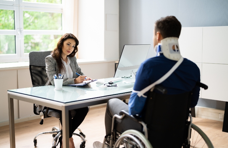 man with injuries is consulting with lawyer