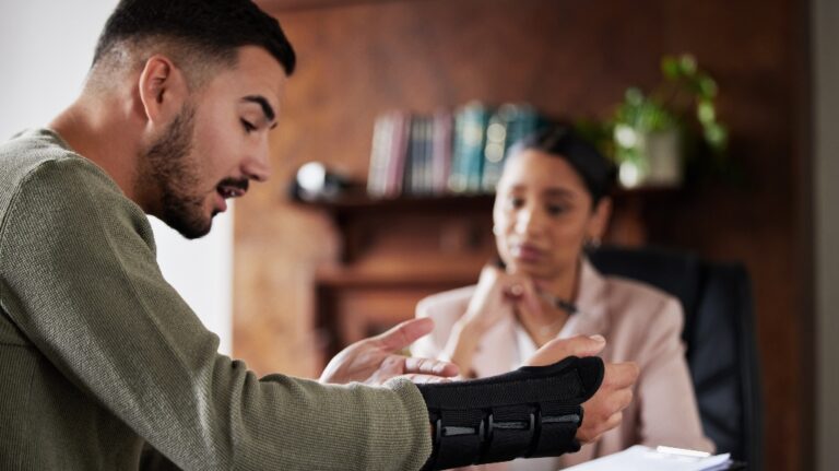 Injured man is consulting with lawyer